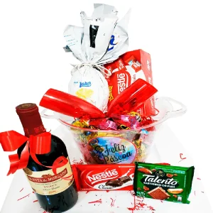Cesta de páscoa com vinho e chocolates no balde
